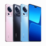 Four Xiaomi smartphones in pink, black, and blue colors, shown from the back with prominent camera modules, plus a front blue-screen model on the right