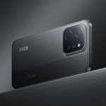 Close-up of a dark POCO smartphone back with a square camera module and two lenses nearby the flash area.