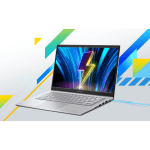 Open silver laptop displaying a neon blue wallpaper on a geometric, colorful background with diagonals and shapes.
